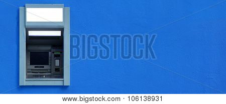 Atm Or Abm Or Cashpoint Machine Byilt-in The Blue Wall