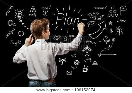 Red-haired Boy Standing And Something Draws