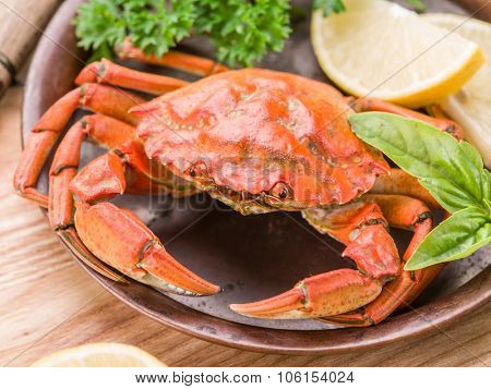 Seafood dish - cooked crab with lemon and herbs.