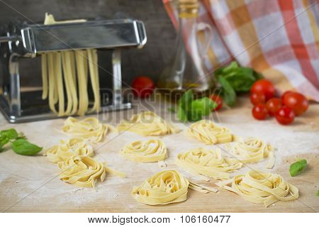 Fresh Homemade Pasta Machine Pasta, Basil,. Tomatoes On A Wooden Background