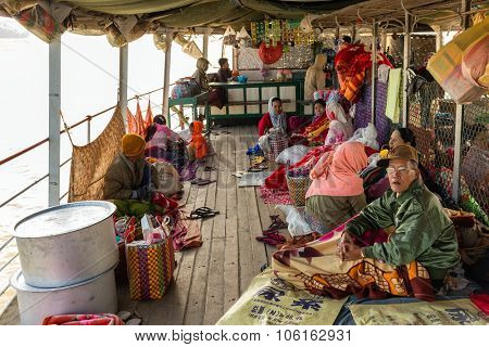 BAGAN, MYANMAR, JANUARY 22, 2015 : The Burmese passengers are waking up in the morning on the boat's deck going from Mandalay to Bagan in Myanmar (Burma).