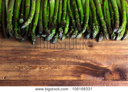 Background. Fresh Asparagus On Wooden Table