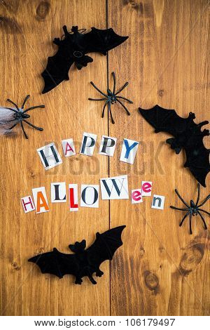 Happy Halloween Letters Cut Out From The Magazines, Bats, Web And Black Spiders