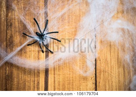 Halloween Symbols Web And Black Spiders On Wooden Background