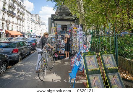 News stand on a street corner in Paris
