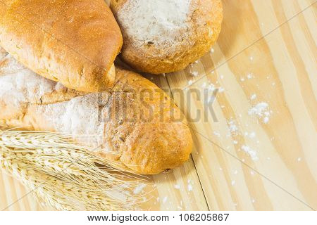 Bread And Wheat On The Wood Background, Warm Toning, Selective Focus