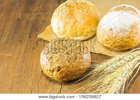 Bread And Wheat On The Wood Background, Warm Toning, Selective Focus