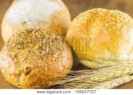 Bread And Wheat On The Wood Background, Warm Toning, Selective Focus