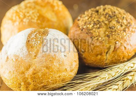 Bread And Wheat On The Wood Background, Warm Toning, Selective Focus