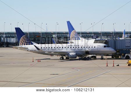 United Express Embraer plane on tarmac at O'Hare International Airport in Chicago