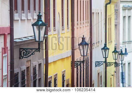 Colored facades with street lamps in Prague