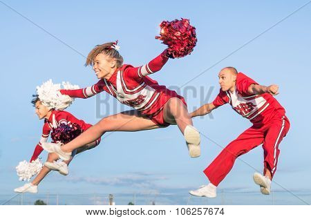 Cheerleaders Team With Male Coach