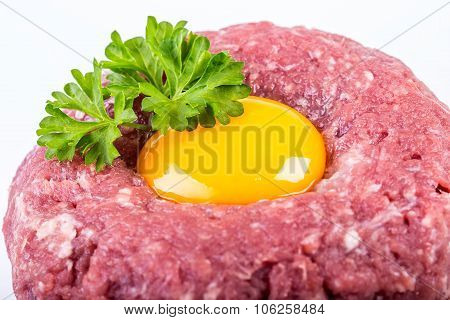 Raw beef .Tasty Steak tartare. Classic steak tartare over white. Ingredients: Raw beef meat salt pep
