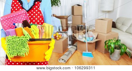 Maid hands with cleaning tools. House cleaning service concept.