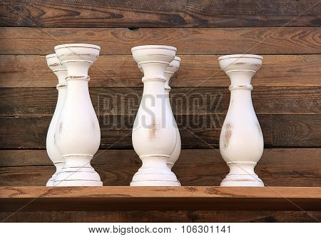 Three empty white ceramic vases