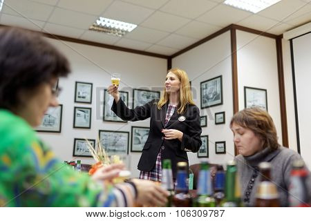 ST. PETERSBURG, RUSSIA - OCTOBER 24, 2015: Tourists during tasting session at the Baltika - St Petersburg brewery. This session is a part of the October Beer Festival celebrations