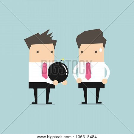 Businessman holding a large bomb