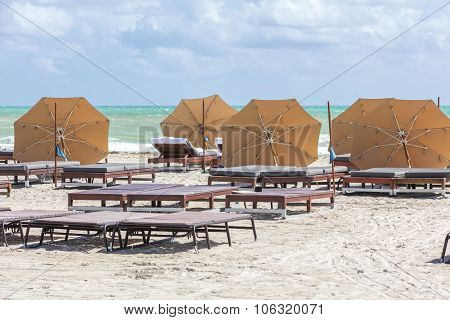 Sun Umbrellas On The Beach Of Ocean. Miami Beach, Florida.