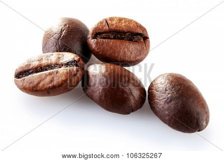 Brown coffee beans isolated on white