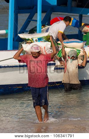 Men Transports Cargo From Ship