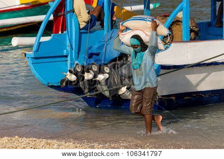 Men Transports Cargo From Ship
