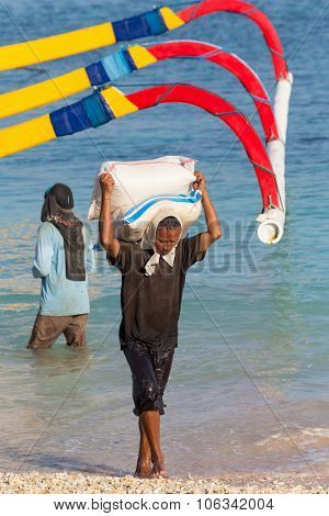 Men Transports Cargo From Ship