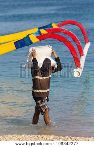 Men Transports Cargo From Ship