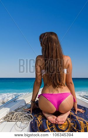 Beautiful girl relaxing on a speed boat 