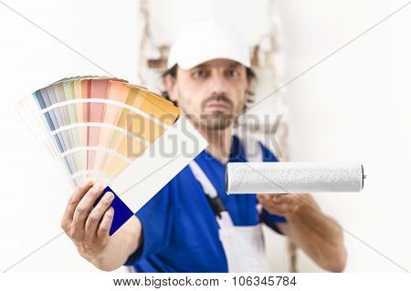 Close Up Shot Of Painter Man Showing A Color Palette