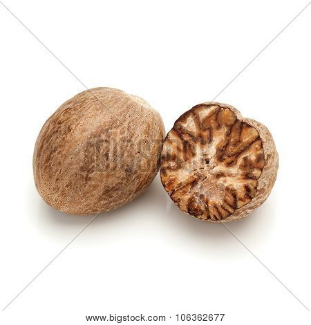 Full and a cracked Organic Nutmeg Seed.