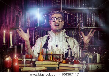 Crazy old man medieval scientist working in his laboratory. Alchemist. Halloween.