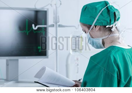 Medic Standing With Medical Documentation