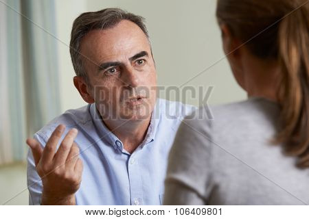 Depressed Mature Man Talking To Counsellor