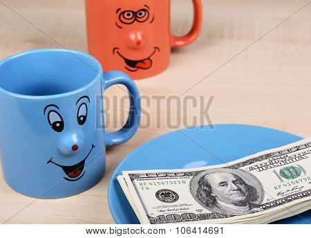 Cup and dollar. The cup is looking for dollars