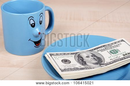 Cup and dollar. The cup is looking for dollars