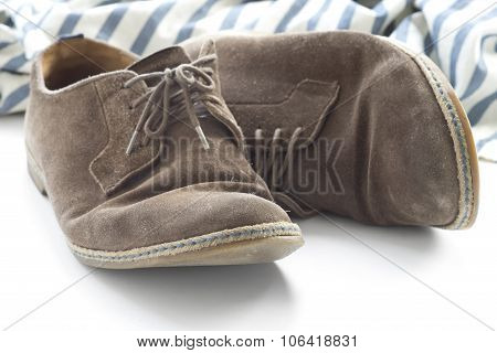 Brown shoes and striped shirt