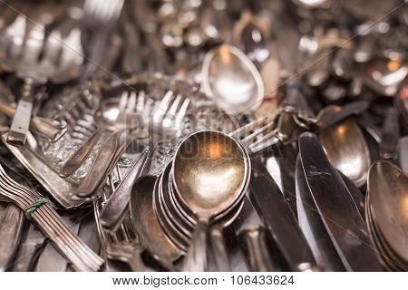 Bunch Of Old Silver Ware On A Flea Market