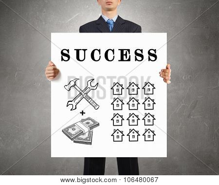 Businessman holding banner with drawn money earning concept