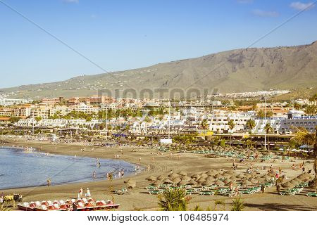 Sandy Beach With Thatched Parasols And Sunbeds, Costa Adeje, Tenerife, Spain