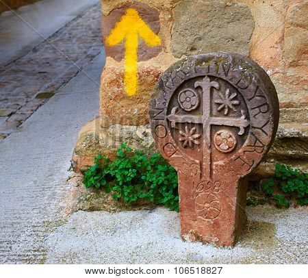 The way of Saint james yellow arrow sign in Cirauqui Pamplona Spain