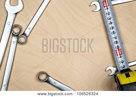 Tools and wrenches on the wood plate