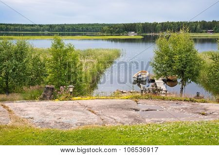 Small boat moored by the jetty in inlet