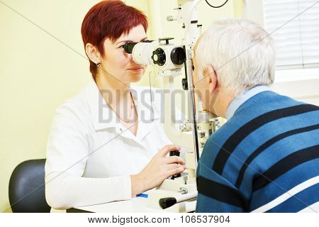 Optometry concept. female optometrist optician doctor examines eyesight of female patient in eye ophthalmological clinic 