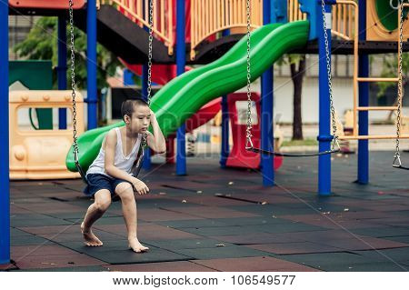 Sad Boy At Playground