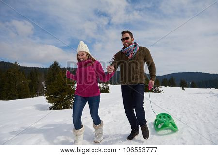 romantic winter  scene, happy young couple having fun on fresh show on winter vacatio, mountain nature landscape