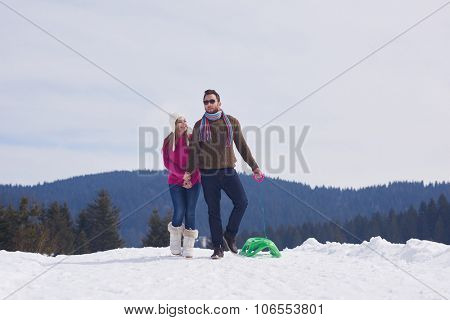 romantic winter  scene, happy young couple having fun on fresh show on winter vacatio, mountain nature landscape