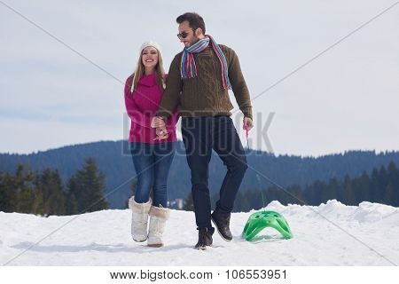 romantic winter  scene, happy young couple having fun on fresh show on winter vacatio, mountain nature landscape