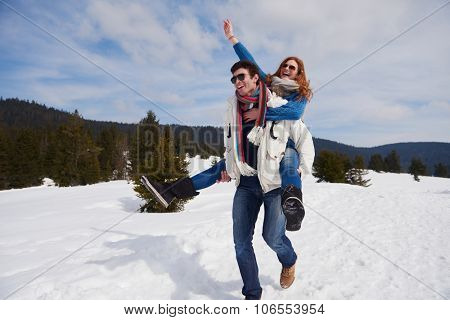 romantic winter  scene, happy young couple having fun on fresh show on winter vacatio, mountain nature landscape