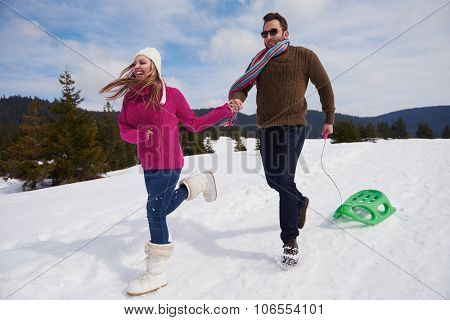 romantic winter  scene, happy young couple having fun on fresh show on winter vacatio, mountain nature landscape