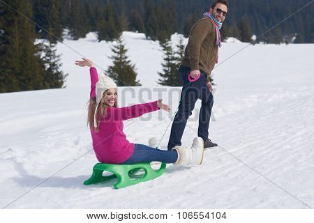 romantic winter  scene, happy young couple having fun on fresh show on winter vacatio, mountain nature landscape
